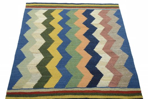 Close-up detail of New Kilim Sofre rug from Iran / Persia showing Wool weave