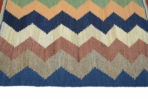 Close-up detail of New Kilim Sofre rug from Iran / Persia showing Wool weave