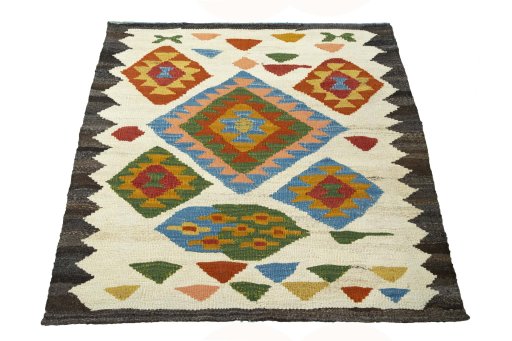 Close-up detail of New Kilim Sofre rug from Iran / Persia showing Wool weave
