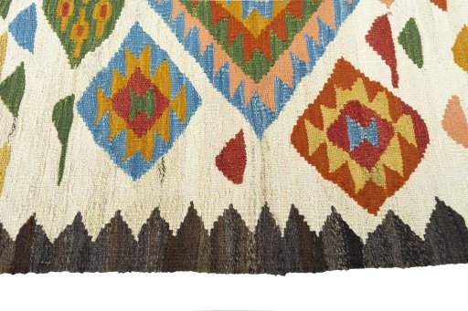 Close-up detail of New Kilim Sofre rug from Iran / Persia showing Wool weave