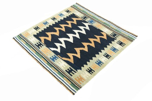 Corner detail of New Kilim Sofre rug showing border pattern and Wool pile