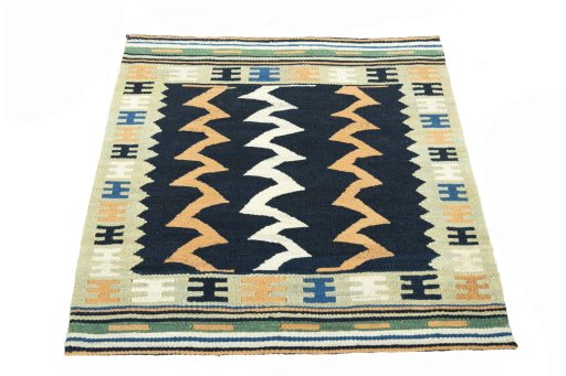 Close-up detail of New Kilim Sofre rug from Iran / Persia showing Wool weave