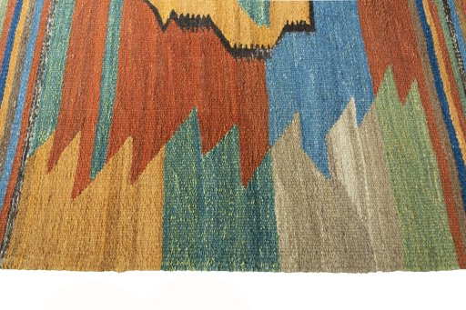 Close-up detail of New Kilim Sofre rug from Iran / Persia showing Wool weave