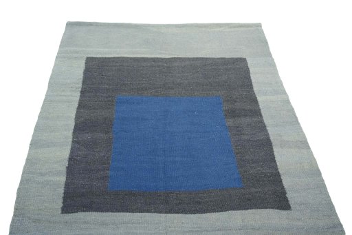Close-up detail of New Kilim Sofre rug from Iran / Persia showing Wool weave
