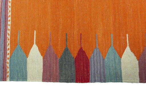 Close-up detail of New Kilim Sofre rug from Iran / Persia showing Wool weave