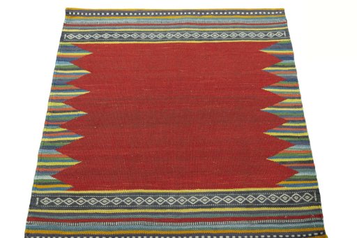 Close-up detail of New Kilim Sofre rug from Iran / Persia showing Wool weave