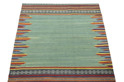 Close-up detail of New Kilim Sofre rug from Iran / Persia showing Wool weave