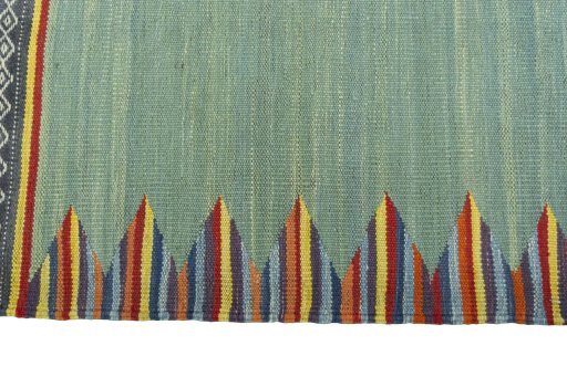 Close-up detail of New Kilim Sofre rug from Iran / Persia showing Wool weave