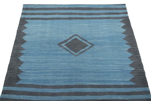 Close-up detail of New Kilim Sofre rug from Iran / Persia showing Wool weave