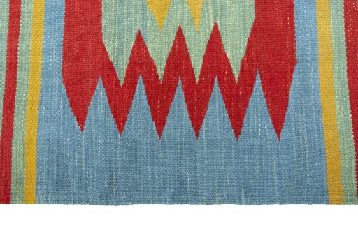 Close-up detail of New Kilim Sofre rug from Iran / Persia showing Wool weave