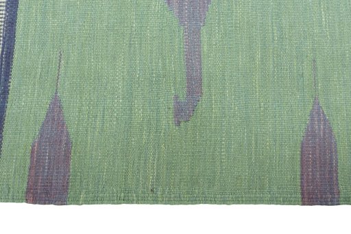 Close-up detail of New Kilim Sofre rug from Iran / Persia showing Wool weave