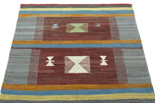 Close-up detail of New Kilim Sofre rug from Iran / Persia showing Wool weave