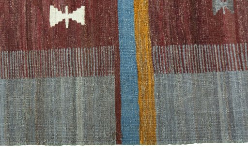 Close-up detail of New Kilim Sofre rug from Iran / Persia showing Wool weave