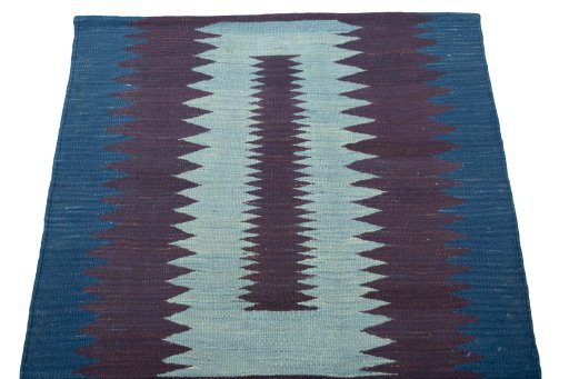 Close-up detail of New Kilim Sofre rug from Iran / Persia showing Wool weave