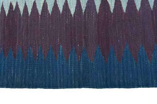 Close-up detail of New Kilim Sofre rug from Iran / Persia showing Wool weave