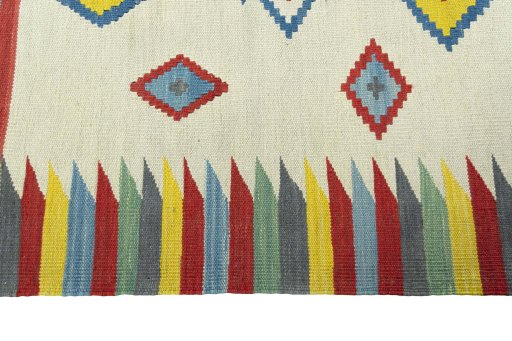 Close-up detail of New Kilim Sofre rug from Iran / Persia showing Wool weave