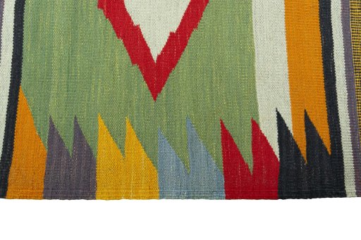 Close-up detail of New Kilim Sofre rug from Iran / Persia showing Wool weave