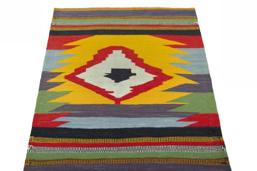 Close-up detail of New Kilim Sofre rug from Iran / Persia showing Wool weave