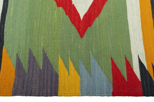 Close-up detail of New Kilim Sofre rug from Iran / Persia showing Wool weave