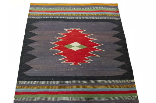 Close-up detail of New Kilim Sofre rug from Iran / Persia showing Wool weave