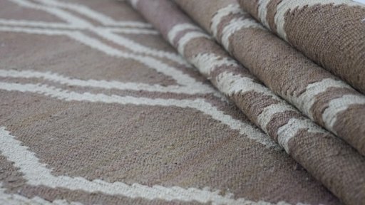 Close-up detail of New Modern Design rug from Iran / Persia showing Wool weave
