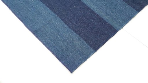Backside of handmade New Modern Design rug showing knot structure and weave density