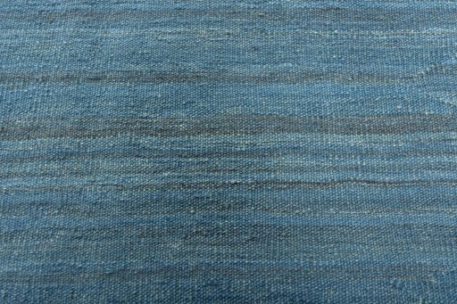 Backside of handmade New Modern Design rug showing knot structure and weave density