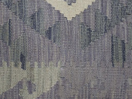 Backside of handmade New Modern Design rug showing knot structure and weave density