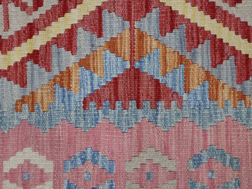 Backside of handmade New Modern Design rug showing knot structure and weave density