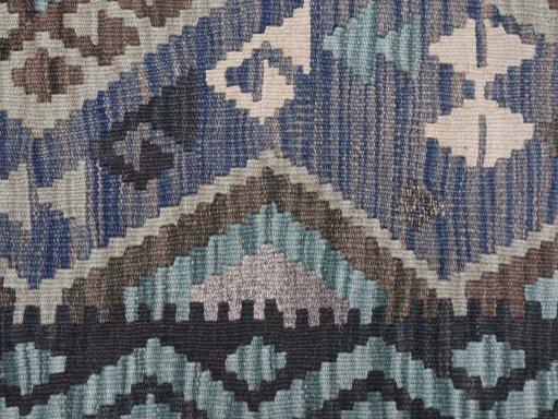 Backside of handmade New Modern Design rug showing knot structure and weave density
