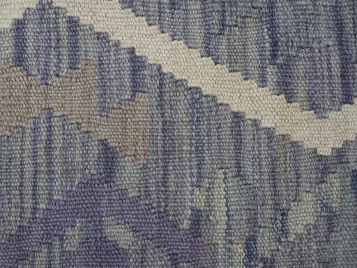 Backside of handmade New Modern Design rug showing knot structure and weave density