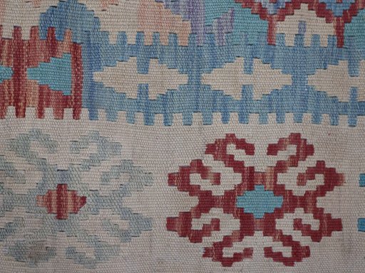 Backside of handmade New Modern Design rug showing knot structure and weave density