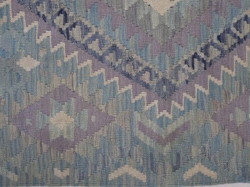 Backside of handmade New Modern Design rug showing knot structure and weave density