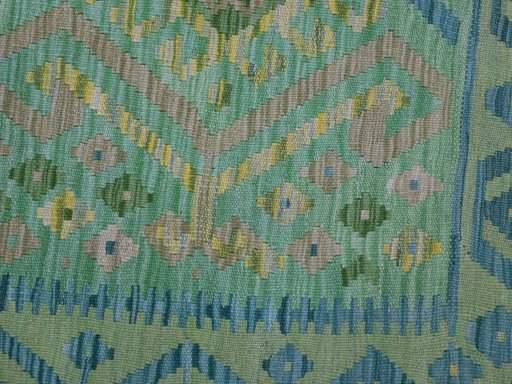 Backside of handmade New Modern Design rug showing knot structure and weave density