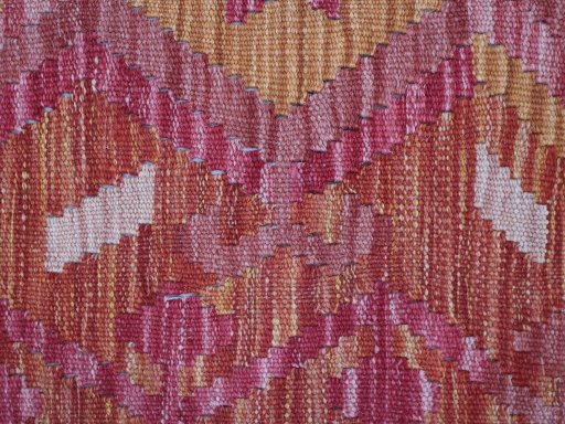 Backside of handmade New Modern Design rug showing knot structure and weave density