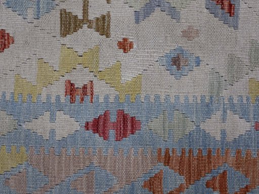 Backside of handmade New Modern Design rug showing knot structure and weave density