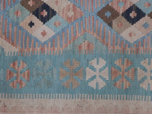Backside of handmade New Modern Design rug showing knot structure and weave density