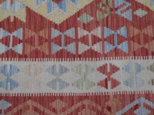 Backside of handmade New Modern Design rug showing knot structure and weave density