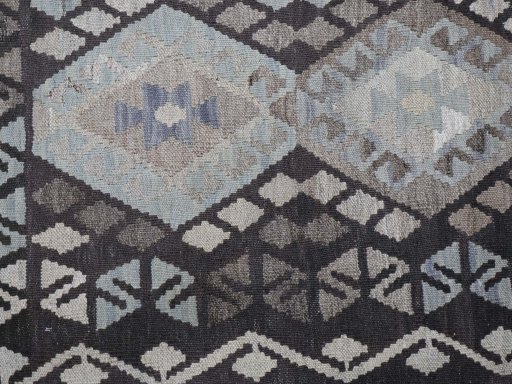 Backside of handmade New Modern Design rug showing knot structure and weave density