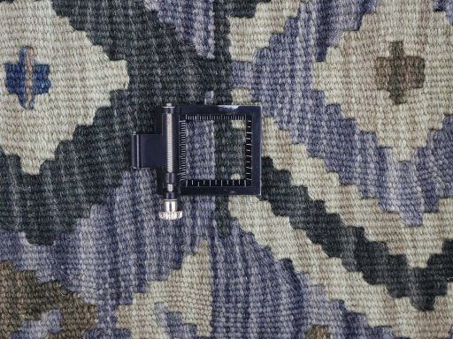 Corner detail of New Modern Design rug showing border pattern and Wool pile