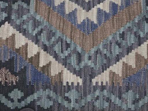 Backside of handmade New Modern Design rug showing knot structure and weave density