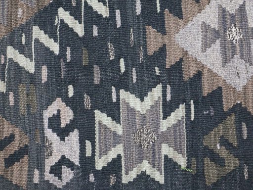 Backside of handmade New Modern Design rug showing knot structure and weave density