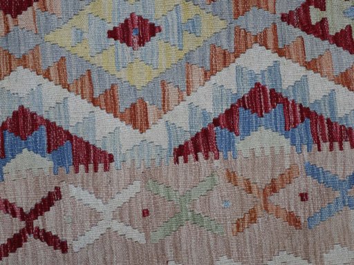 Backside of handmade New Modern Design rug showing knot structure and weave density