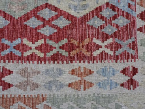 Backside of handmade New Modern Design rug showing knot structure and weave density