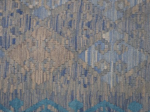 Backside of handmade New Modern Design rug showing knot structure and weave density