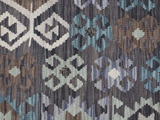 Backside of handmade New Modern Design rug showing knot structure and weave density