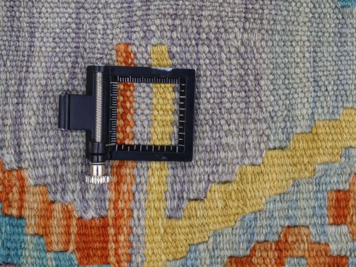 Corner detail of New Modern Design rug showing border pattern and Wool pile
