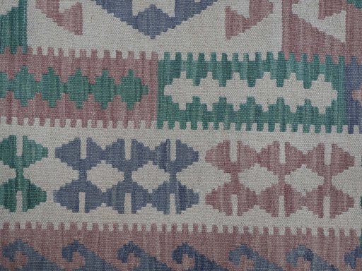 Backside of handmade New Modern Design rug showing knot structure and weave density