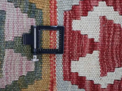 Corner detail of New Modern Design rug showing border pattern and Wool pile
