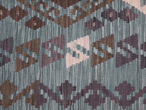 Backside of handmade New Modern Design rug showing knot structure and weave density
